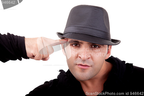 Image of Portrait of a young man, with a finger pointing to the head