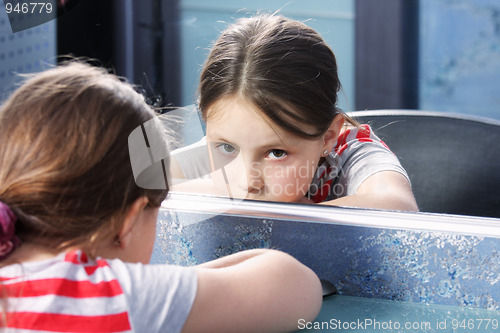 Image of Boring girl at mirror