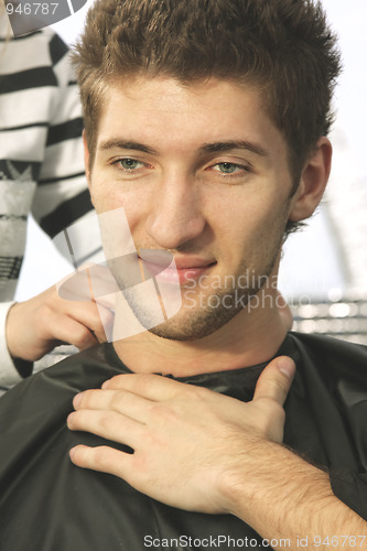 Image of Contented guy at barbers shop