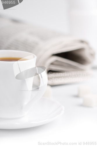 Image of coffee, sugar and stack of newspapers