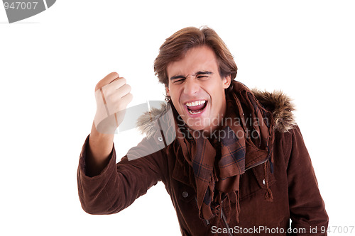 Image of Portrait of a very happy  man with his arm raised