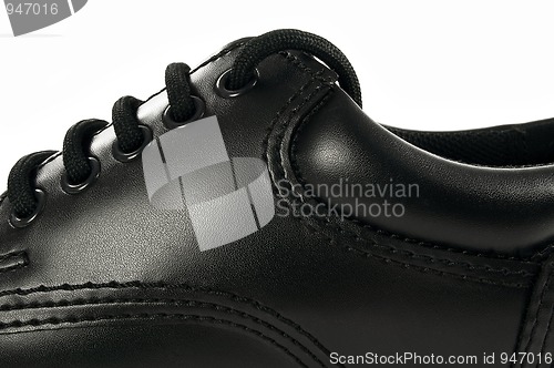 Image of Black leather shoe.