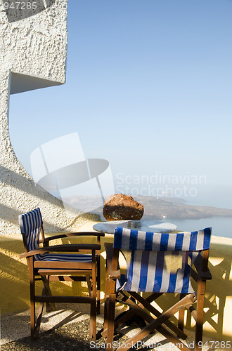 Image of cafe setting Santorini Greece volcanic island view
