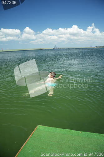 Image of Kid swimming in sea
