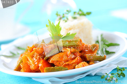 Image of Red chicken curry stripes with rice