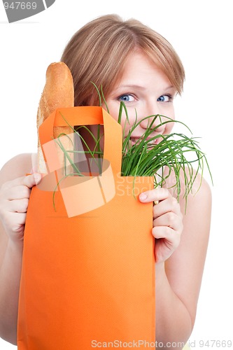 Image of Woman hiding behind shopping bag