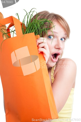 Image of Surprised blond woman with bag