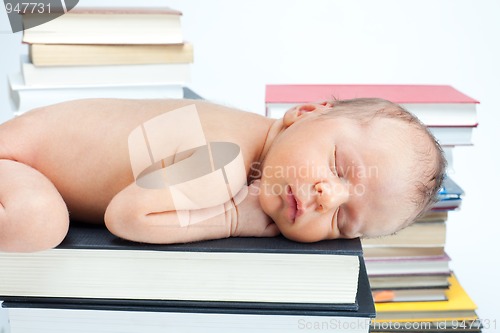 Image of Close-up of baby sleep on the books