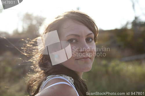 Image of Portrait of attractive woman outdoors.