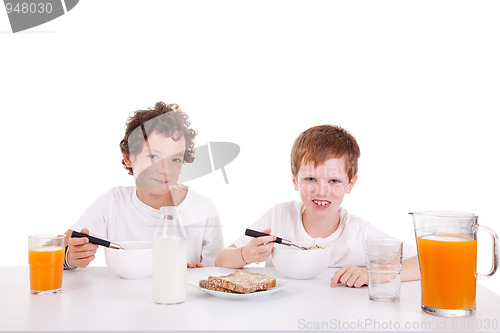 Image of cute boys taking breakfast, isolated on white