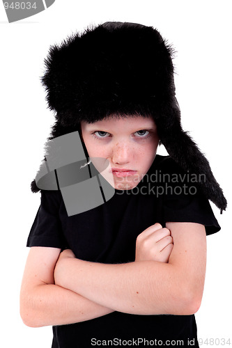 Image of cute boy with a cap, angry, with arms crossed