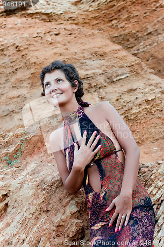 Image of brunet woman in brown dress 