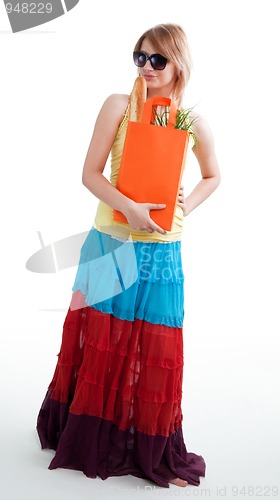 Image of Happy woman with shopping bag