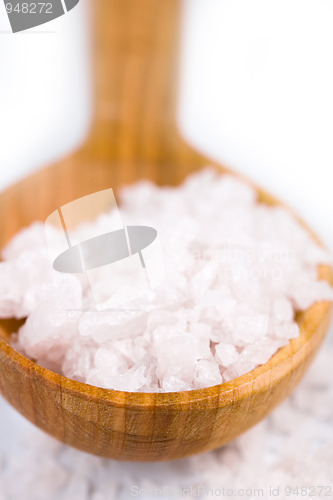 Image of bath salt on a wooden spoon