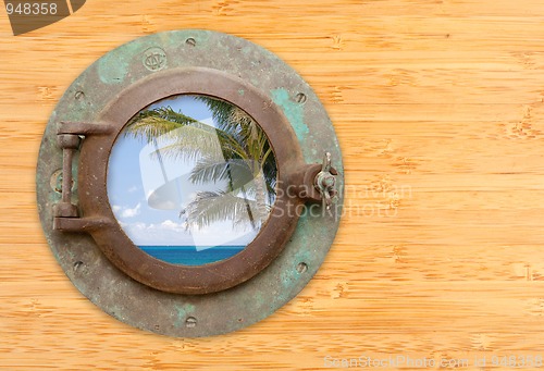 Image of Antique Porthole with Tropical Beach View on Bamboo Wall