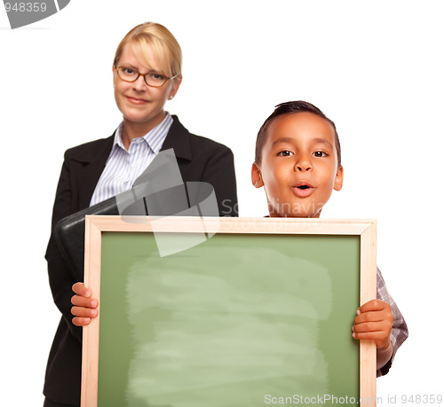 Image of Hispanic Boy Holding Chalk Board and Female Teacher Behind