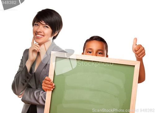 Image of Hispanic Boy Holding Chalk Board and Female Teacher Behind