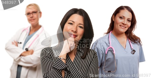 Image of Hispanic Woman with Female Doctor and Nurse