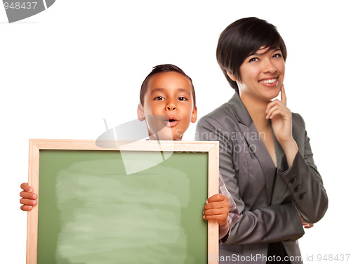 Image of Hispanic Boy Holding Chalk Board and Female Teacher Behind