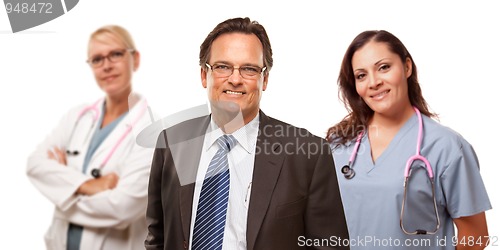 Image of Smiling Businessman with Female Doctor and Nurse