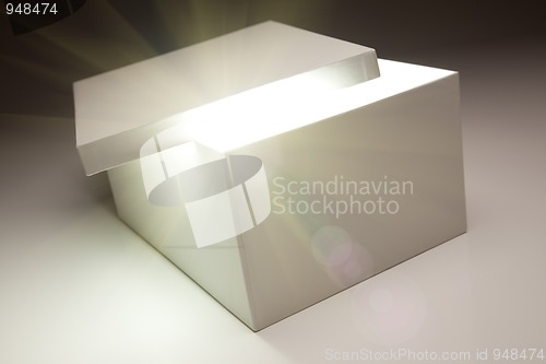 Image of White Box with Lid Revealing Something Very Bright