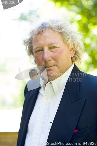 Image of handsome middle age man pipe smoker portrait