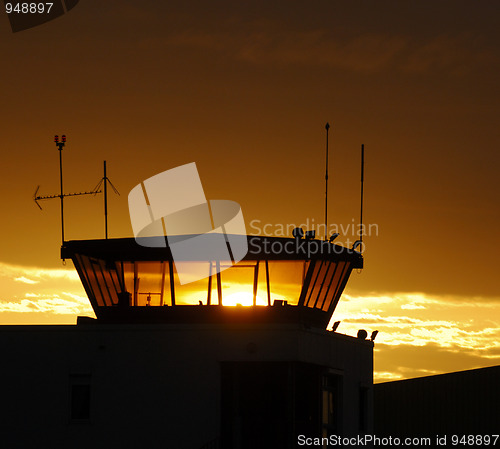 Image of Air traffic control tower on sunset sky