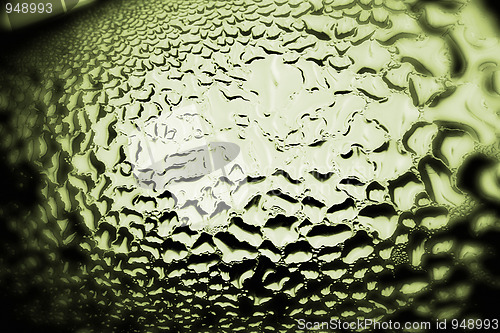 Image of Green drops of water - light from backside. Macro