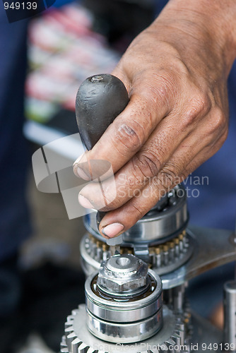 Image of Mechanic repairing a gearbox