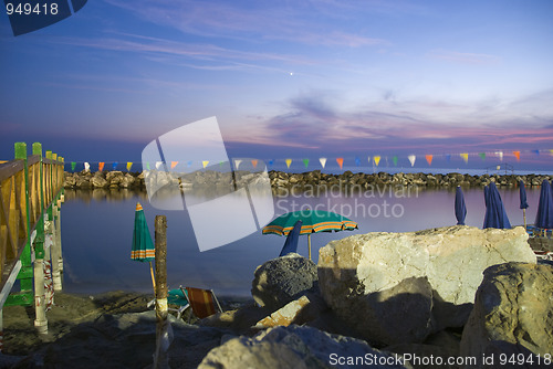 Image of Beach Umbrellas at Sunset