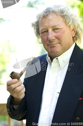 Image of handsome middle age man pipe smoker portrait