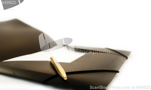 Image of The golden pen with a black folder