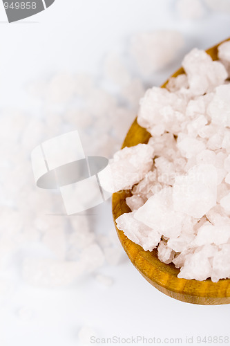 Image of bath salt on a wooden spoon