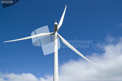Image of Wind turbine in blue sky with cloud