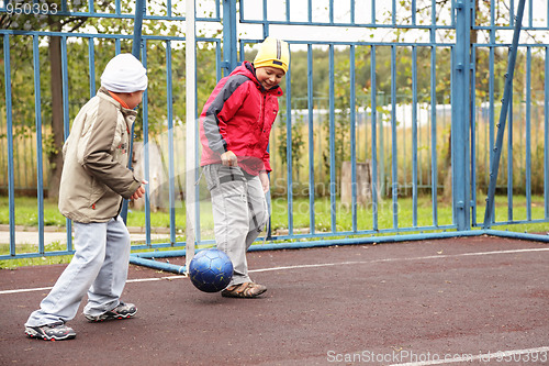 Image of Boys playing football