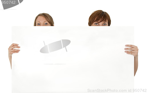 Image of Two young women behind a blank banner ad