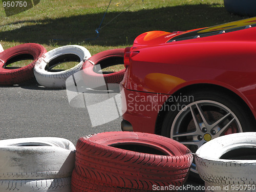 Image of Red car on the racetrack