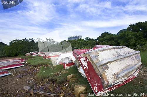 Image of Old fish-boat on sandy beach.