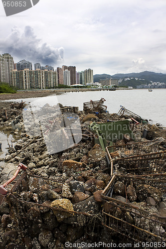 Image of Garbage piled up on the coast of the ocean. 