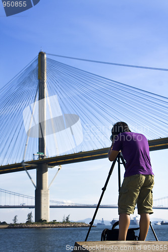 Image of man take photo of the bridge