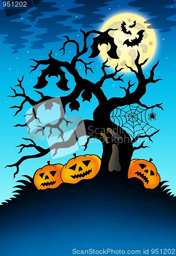 Image of Spooky tree with bats and pumpkins