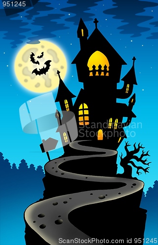 Image of Haunted house on hill with Moon