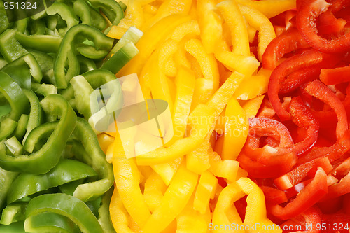 Image of Slices of green, yellow and red bell pepper