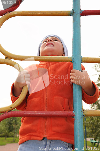 Image of Boy on climbing staircase looking up