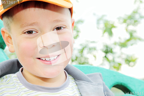 Image of Toothy smiling boy outdoors