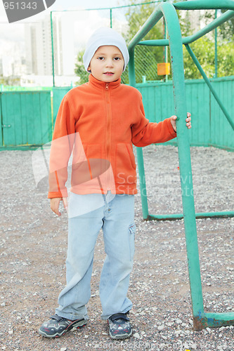 Image of Little boy standing at goal