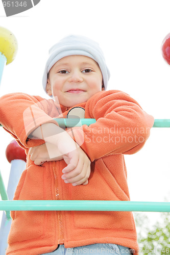 Image of Boy in orange on climbing staircase