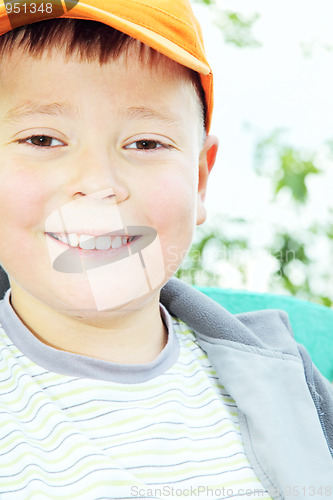 Image of Toothy smiling kid outdoors