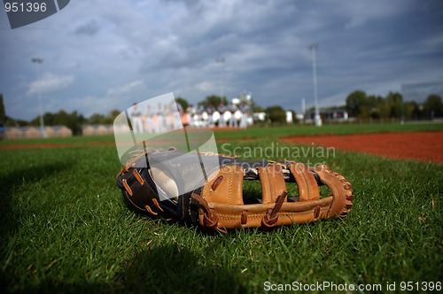 Image of Baseball glove in the grass