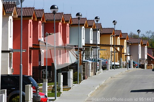 Image of Raw ofwhite red and yellowl houses